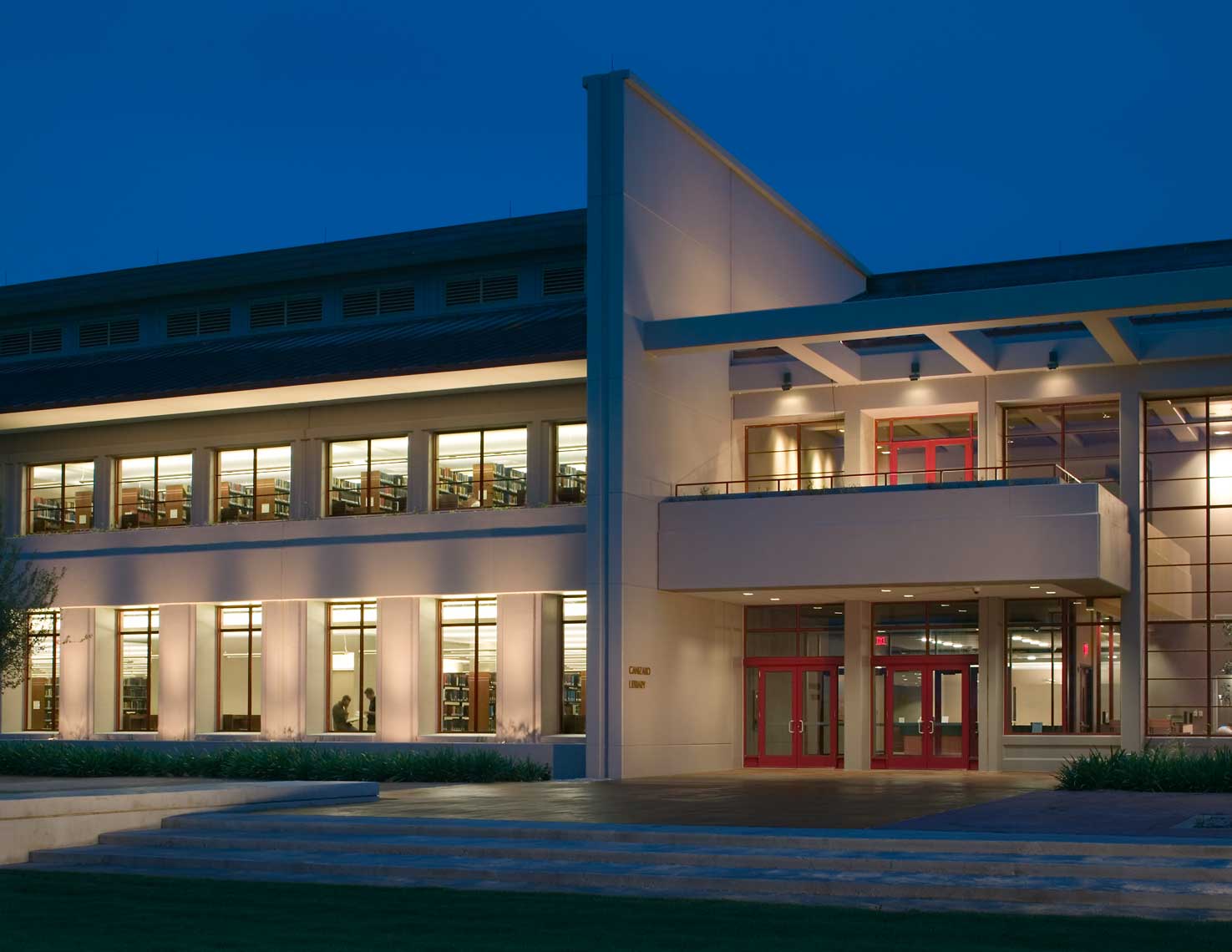A twilight view of the glowing Ave Maria University Library in Naples, Florida