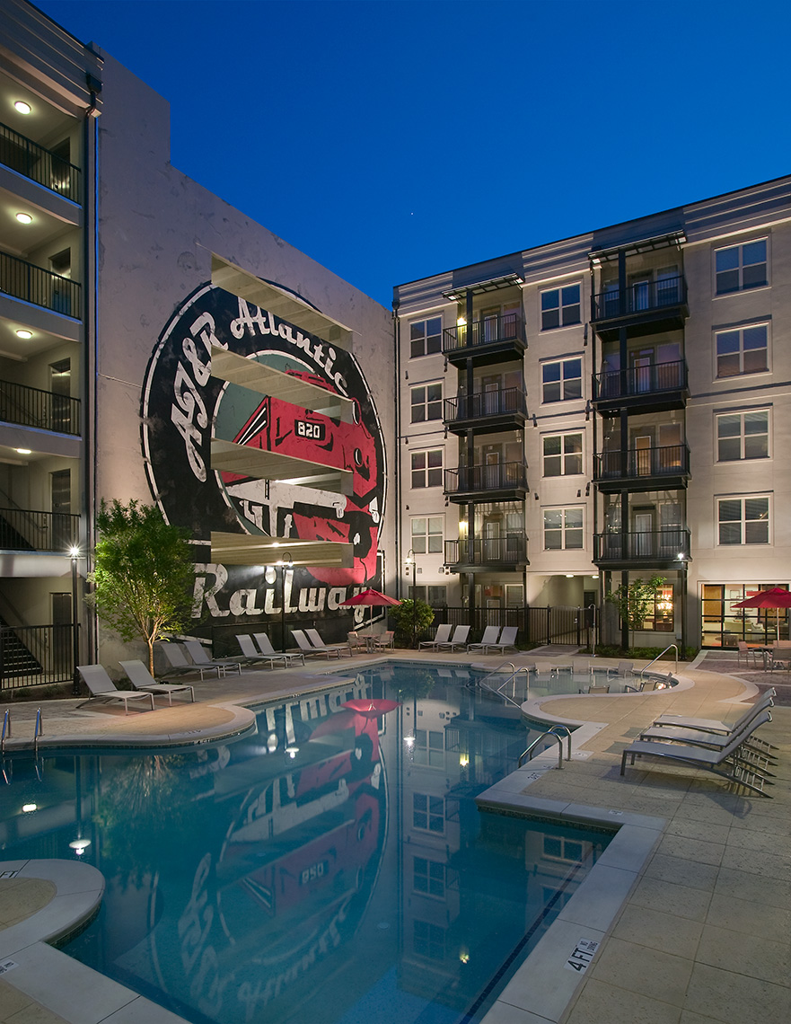 A twilight photograph of the dramatic pool deck of Gables 820 West Apartment community