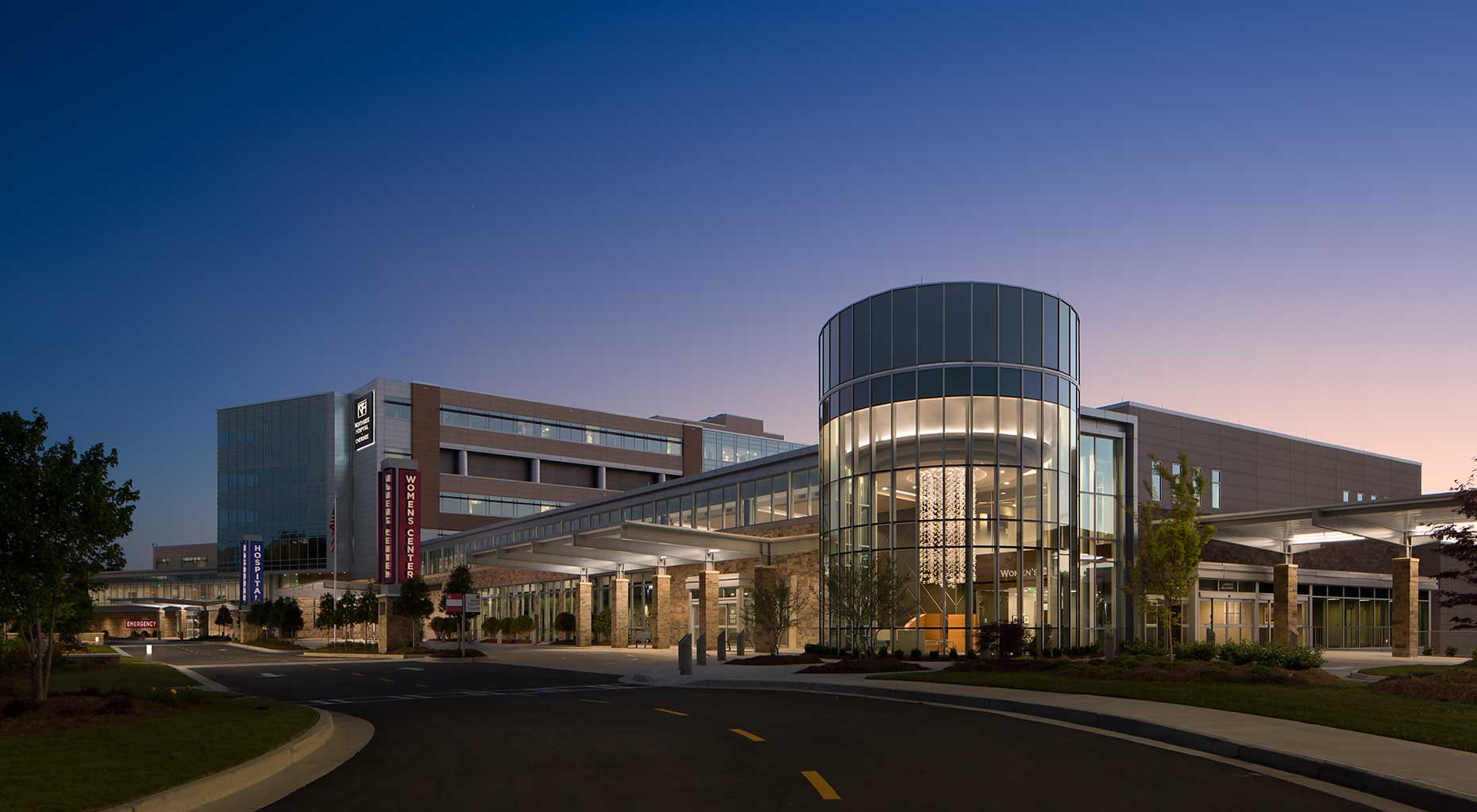 A stunning exterior image of the Northside Hospital Cherokee Womens Center at twilight