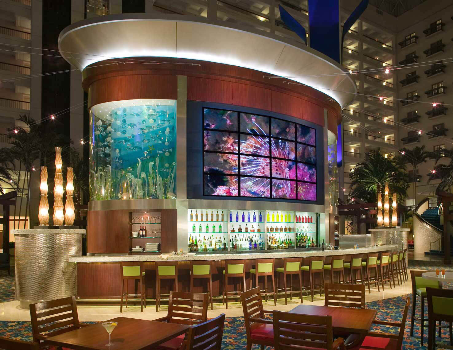 An eye-catching view of the bar and aquarium in the atrium lobby of the Renaissance Orlando Resort at Sea World