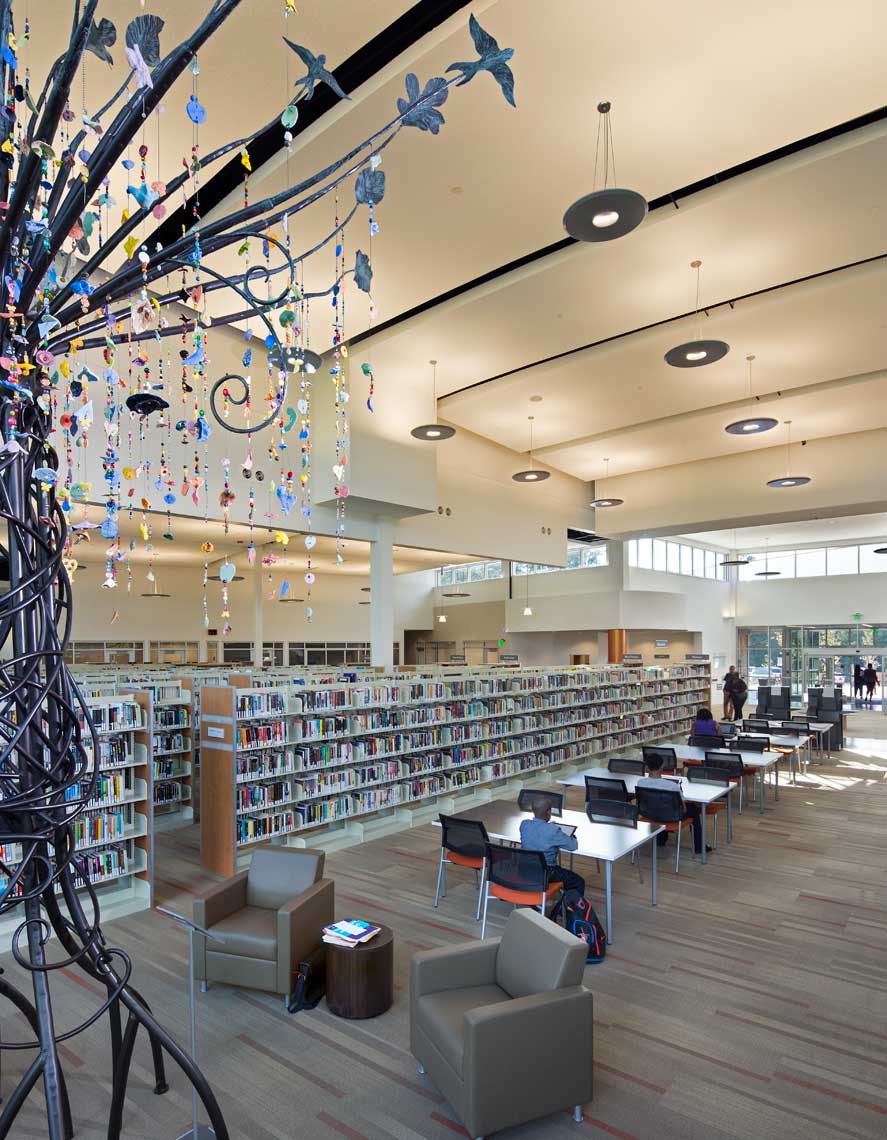 A lovely tree sculpture adorns the stack area of the Wolf Creek Library