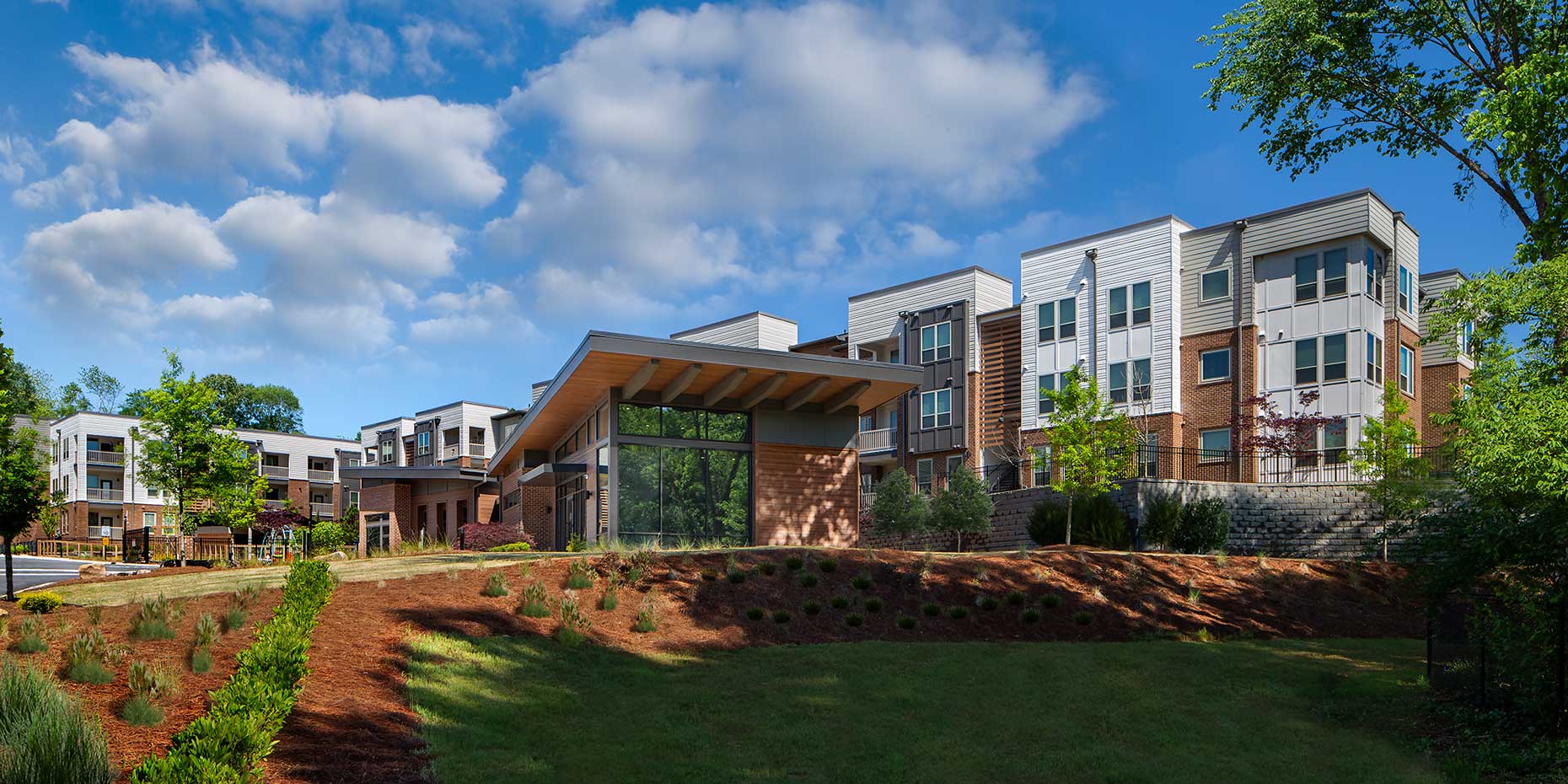 A pastoral setting surrounds the buildings of the Gardenside at Villages of East Lake
