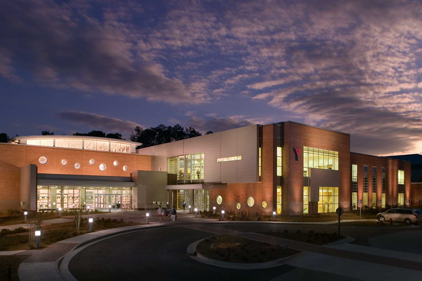 A twilight exterior view of the Summit Family YMCA