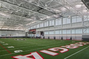 A daytime view of a close-up of the football field at the University of Georgia Indoor Athletic Facility