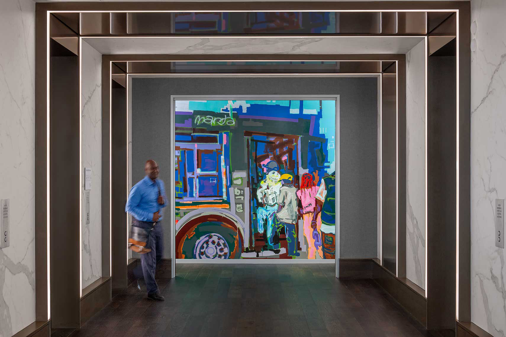Interior view of elevator lobby with mural within corporate office space