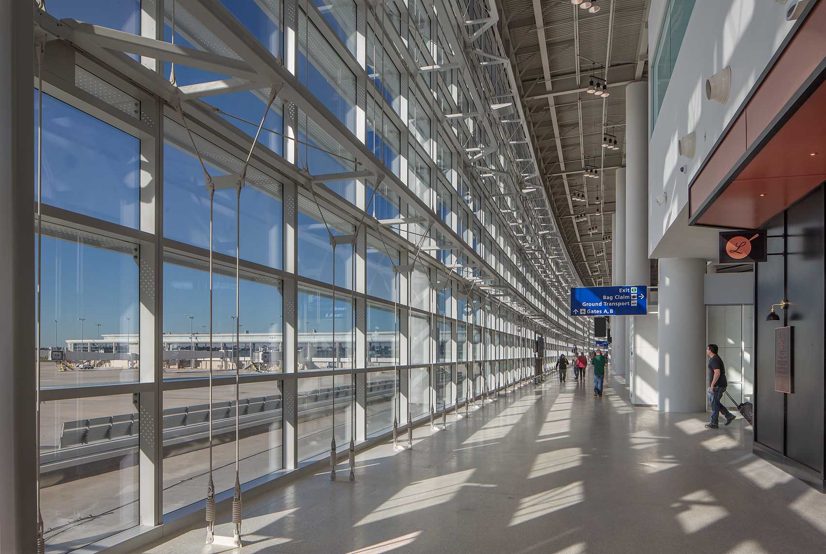 Louis Armstrong New Orleans International Airport | Terminal Walkway to Concourse<br>LEO A DALY