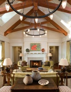 Interior view of the living room with fireplace and wood beams in a Cashiers residence