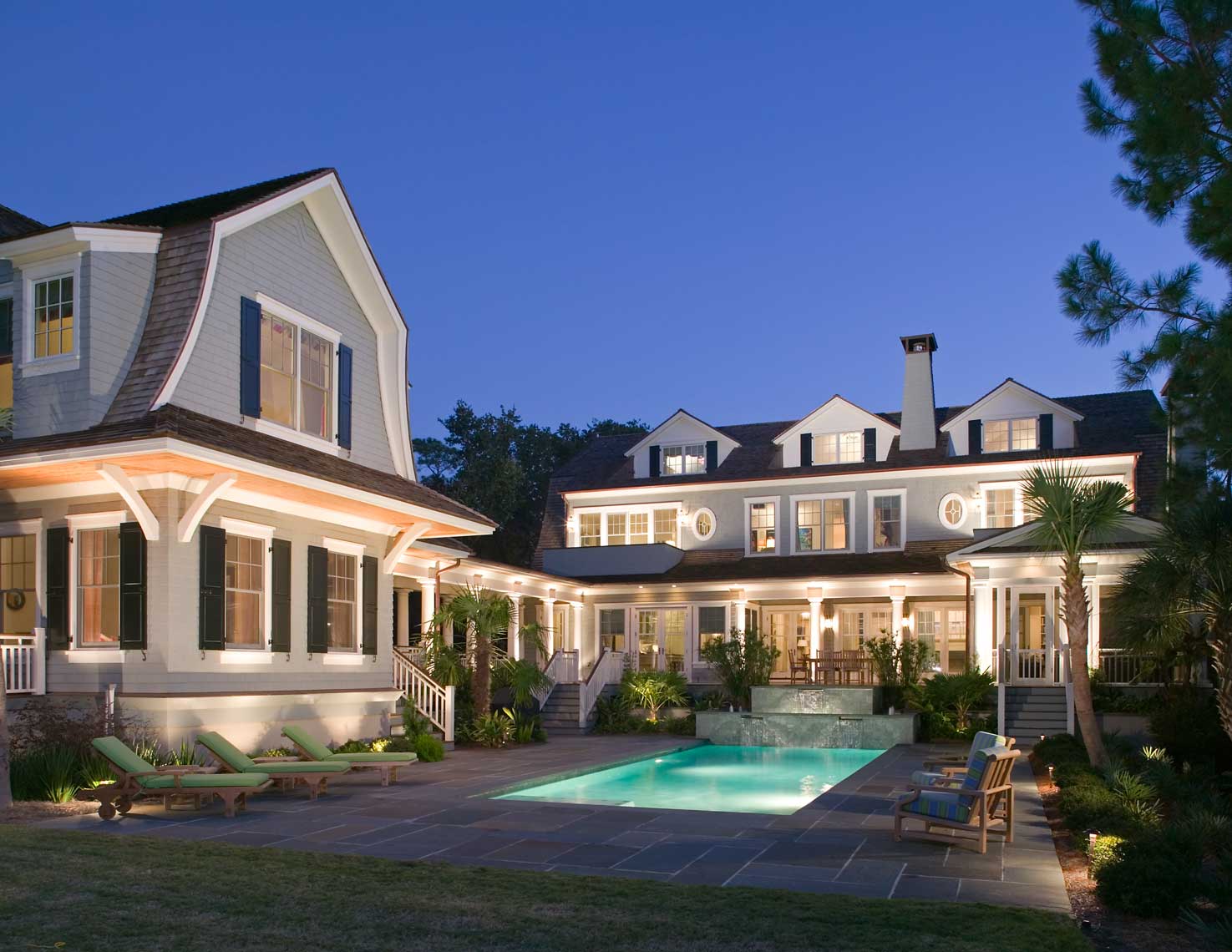 Exterior view of a Kiawah Island Residence and its pool shot at twilight
