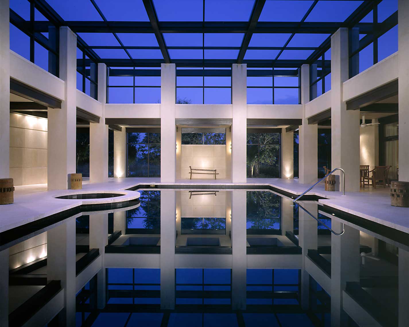 Interior view of a swimming pool in a Naples Residence shot at twilight