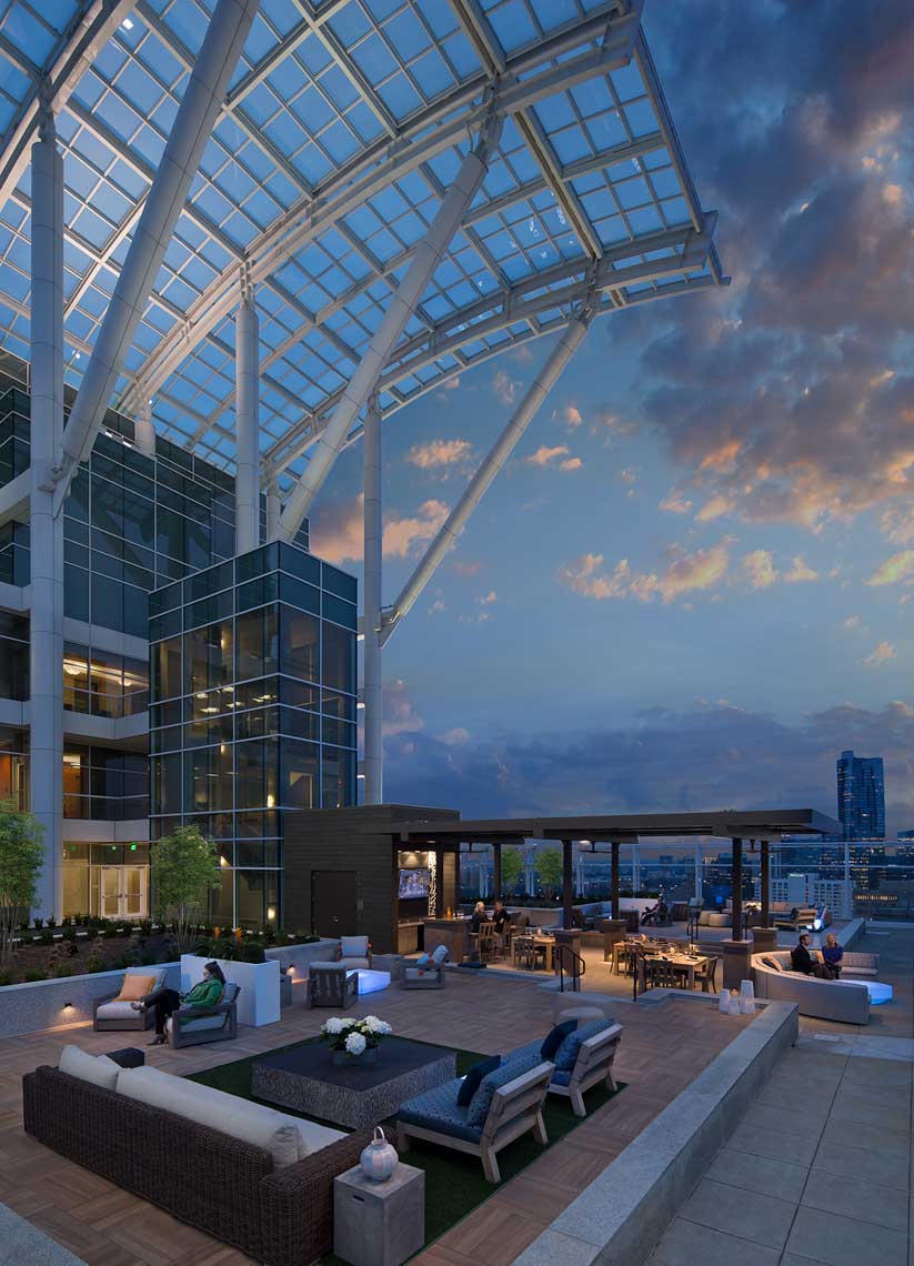 Twilight view of the architecture of the rooftop lounge at SkyGarden at Pinnacle