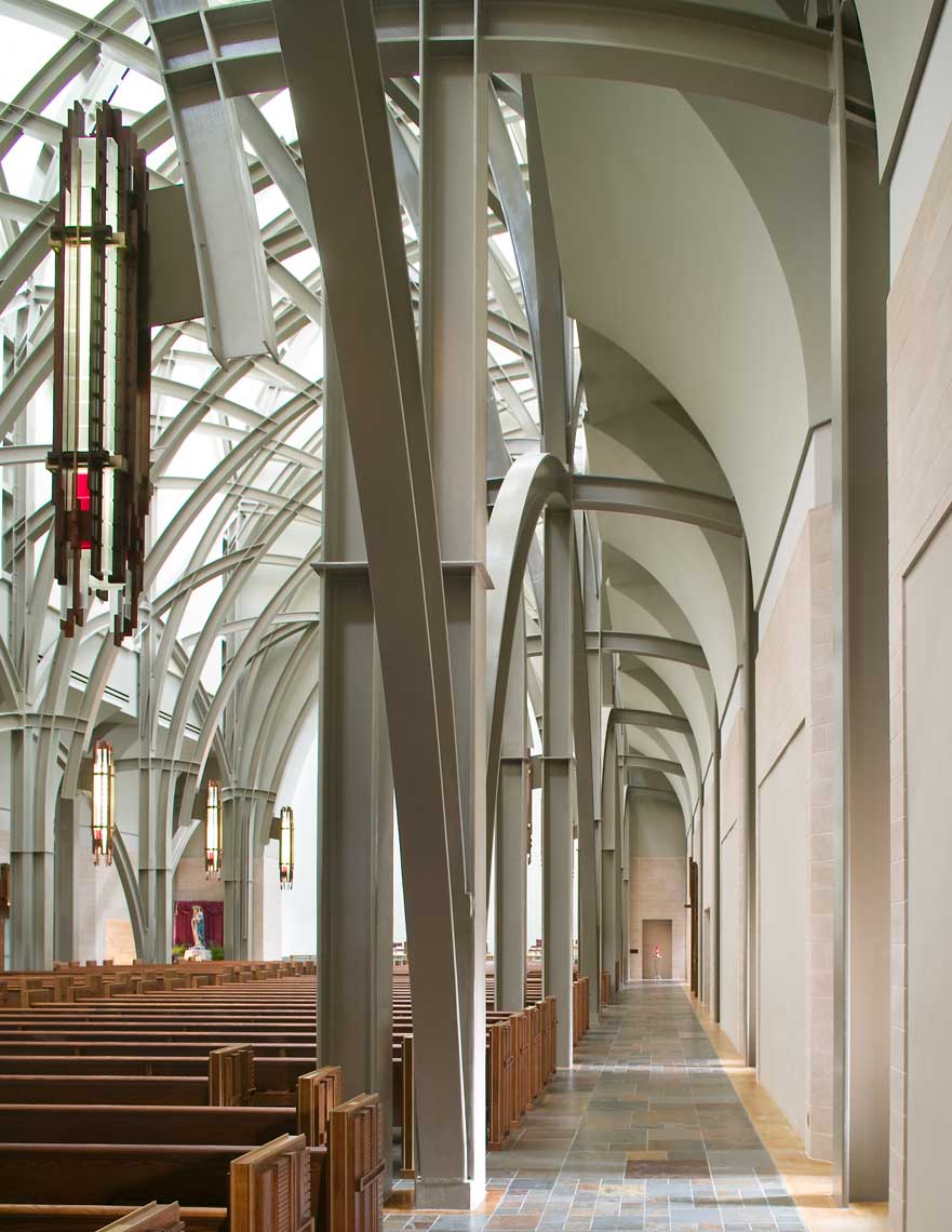 An interior photo showing the design and extensive trusswork at the Oratory at the Ave Maria University