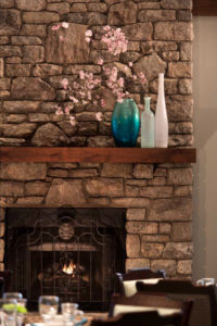 A detail view of the fireplace in the dining room at Grace Ridge in Morganton, North Carolina