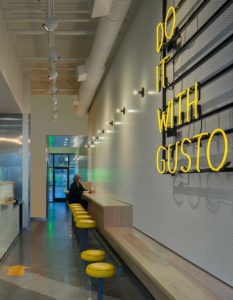 A view of the indoor seating and accent neon at the Gusto! West Midtown location