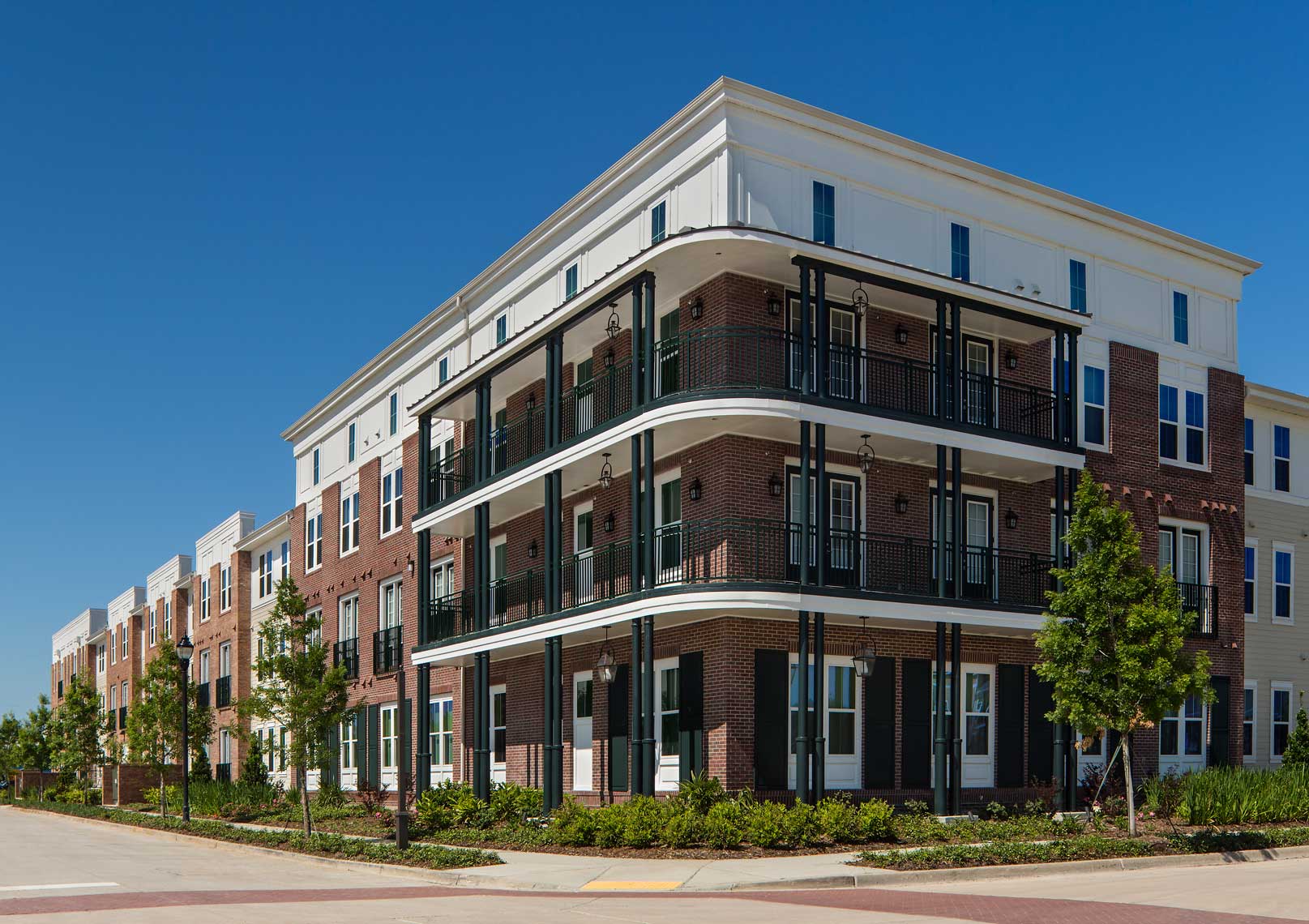 Heritage Senior Residences at Columbia Parc New Orleans | Streetscape<br>Columbia Residential / JHP Architecture