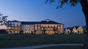 A twilight photo of the various architectural styles at Heritage Senior Residences at Columbia Parc