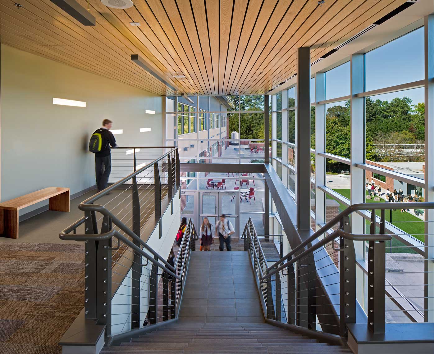 Students enjoy the airy grand stair at the Commons Building at Holy Innocents Episcopal School in Atlanta, Georgia