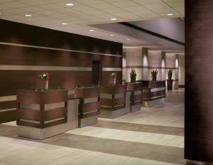 A sleek and inviting view of the reception desk at the Hyatt Regency Indianapolis