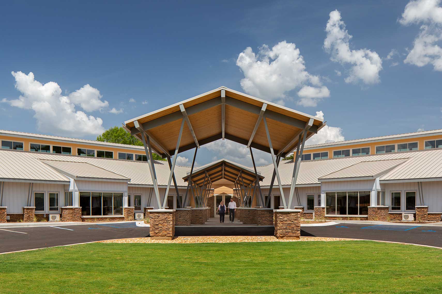 A symmetrical view of the canopy and building at Magnolia Manor Senior Living Community