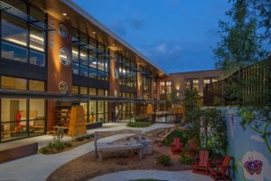 An interesting twilight view of the YMCA ELC and LLC with the play area in the foreground