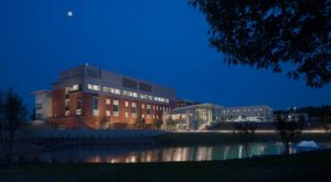An overall twilight view of the Midlands Tech Engineering & Science building across the water