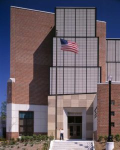 Daytime view of Minor Elementary School with Student Raising Flag