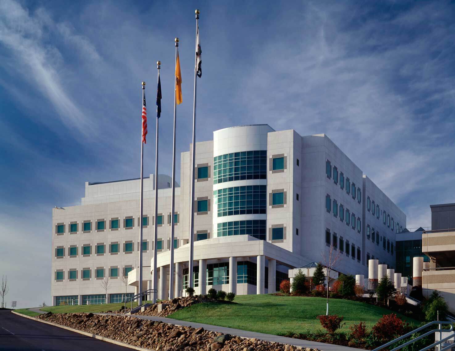 A daytime exterior view of the architecture at NIOSH and its surrounding landscaping
