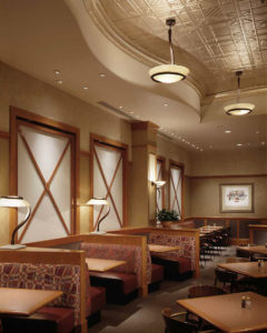 A photo of the interior of Nordstrom’s Café Dining Room with varied seating and a tin ceiling