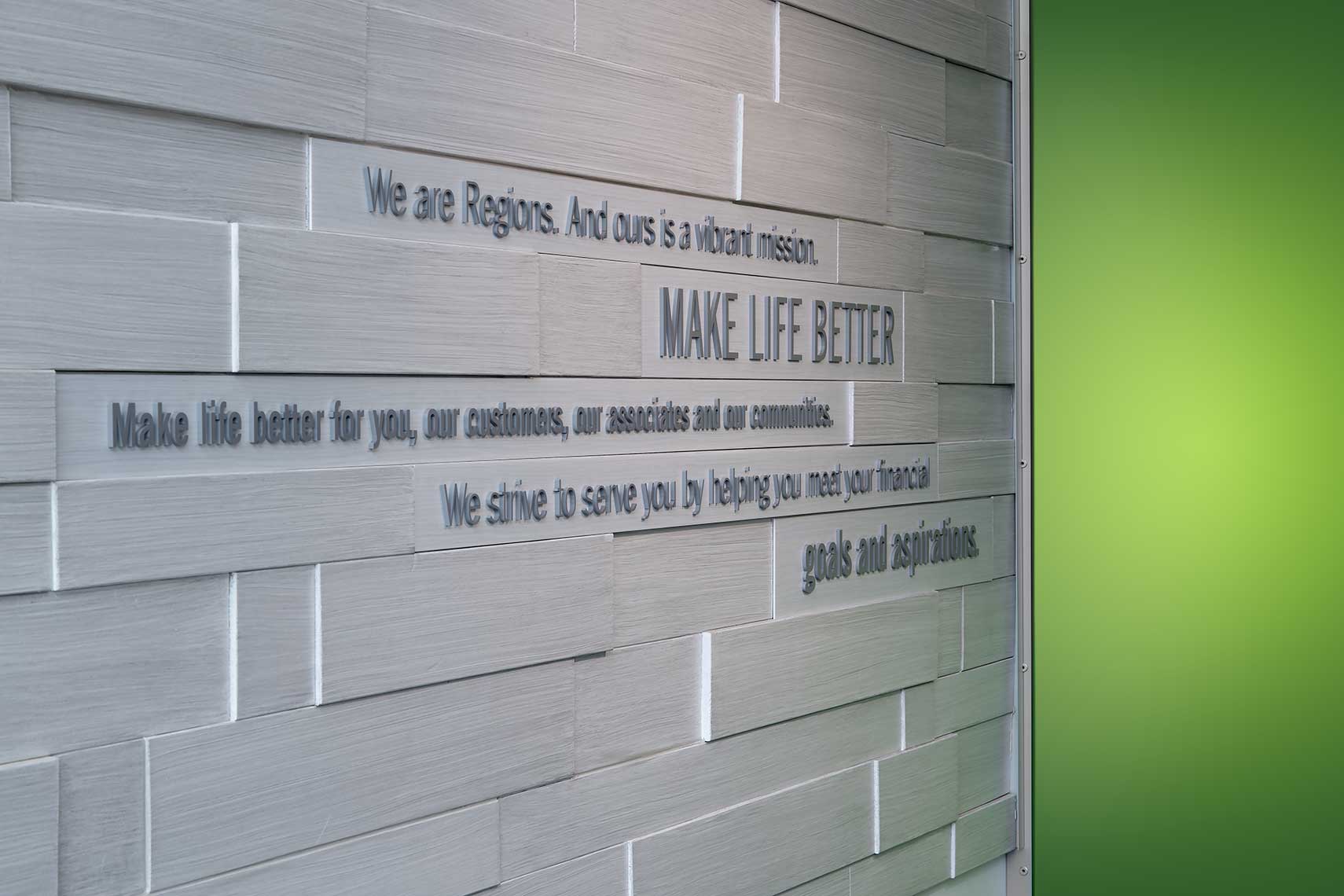 A view of the “message wall” showing some of the branding at Regions Bank in Germantown, TN