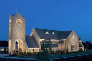 A dramatic twilight view of the exterior of the St. Andrew Lutheran Church in Franklin, TN