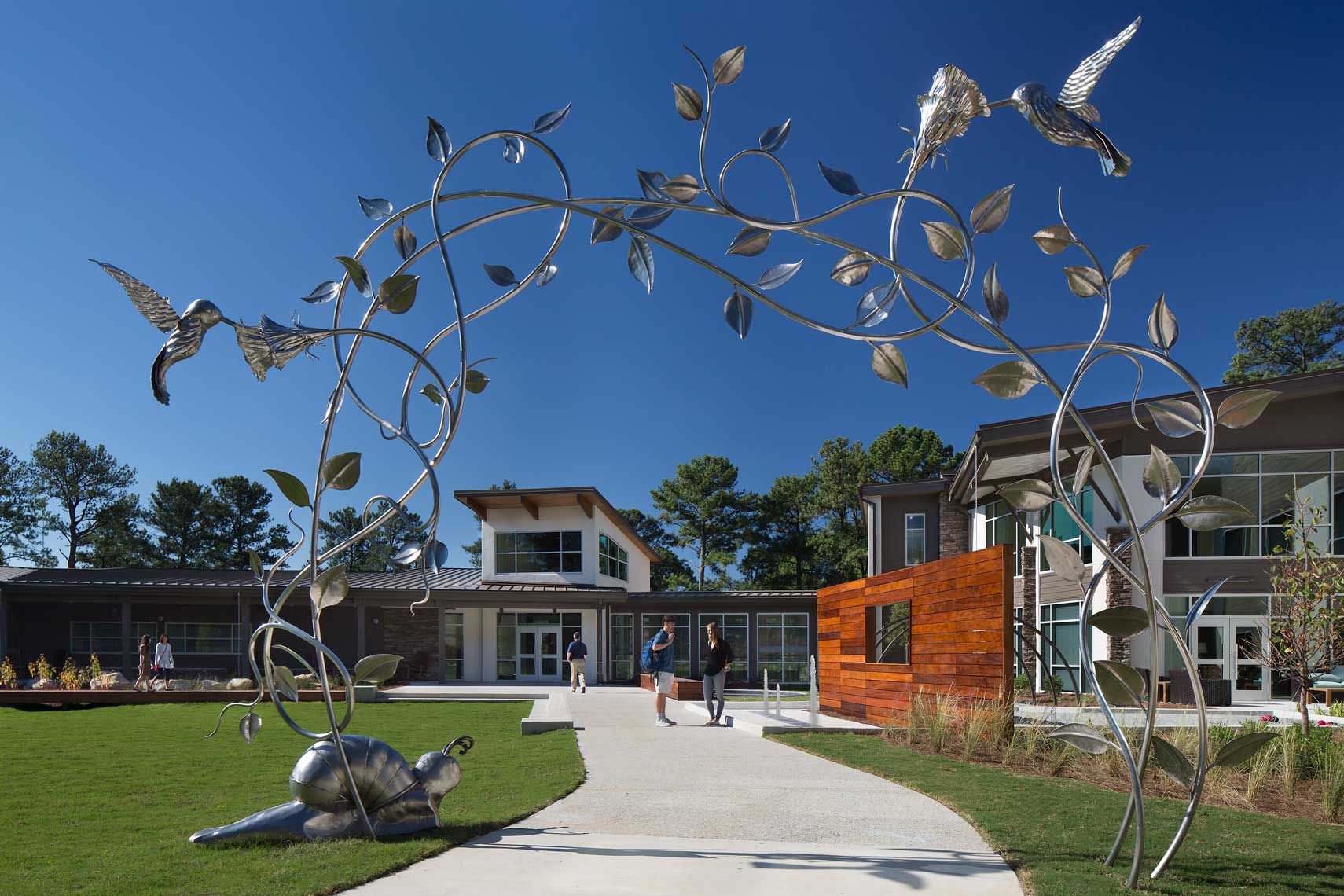 This inviting photo shows how a sculpture as a canopy delights visitors to at Skyland Trail
