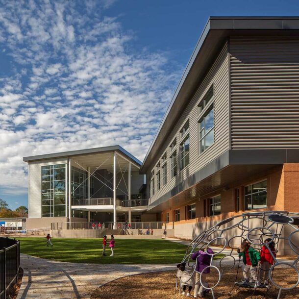 Children enjoy the playground at the Tuskegee Airmen Global Academy - Atlanta Architectural Photographers