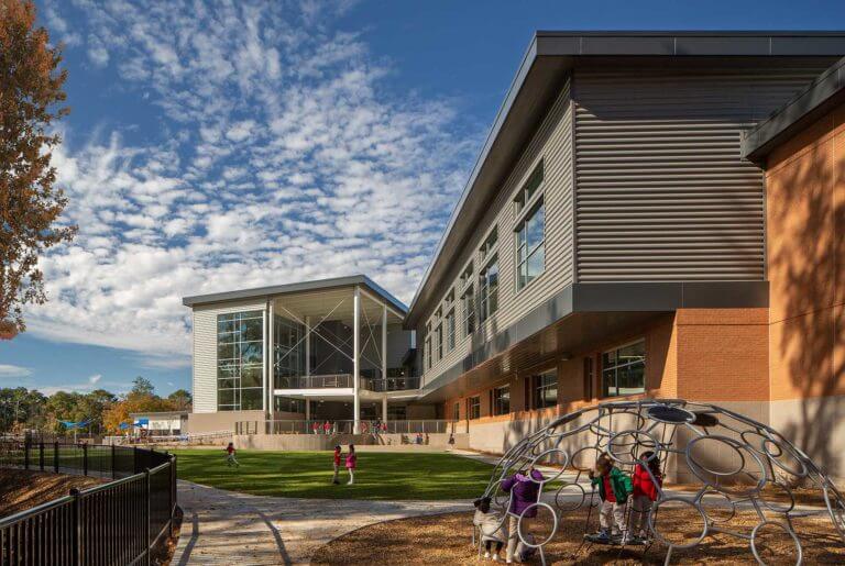 Children enjoy the playground at the Tuskegee Airmen Global Academy - Atlanta Architectural Photographers