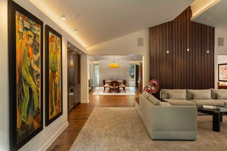 An interior view of the living and dining spaces of a redesigned mid-century home
