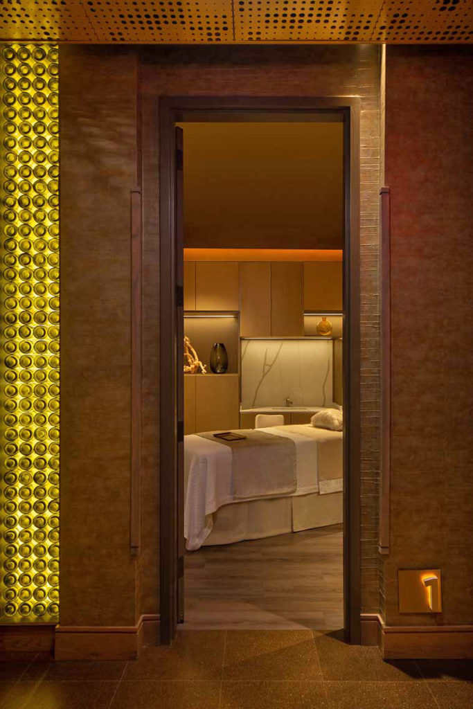 A photograph of a private massage room as seen from the corridor at Spa Reserve