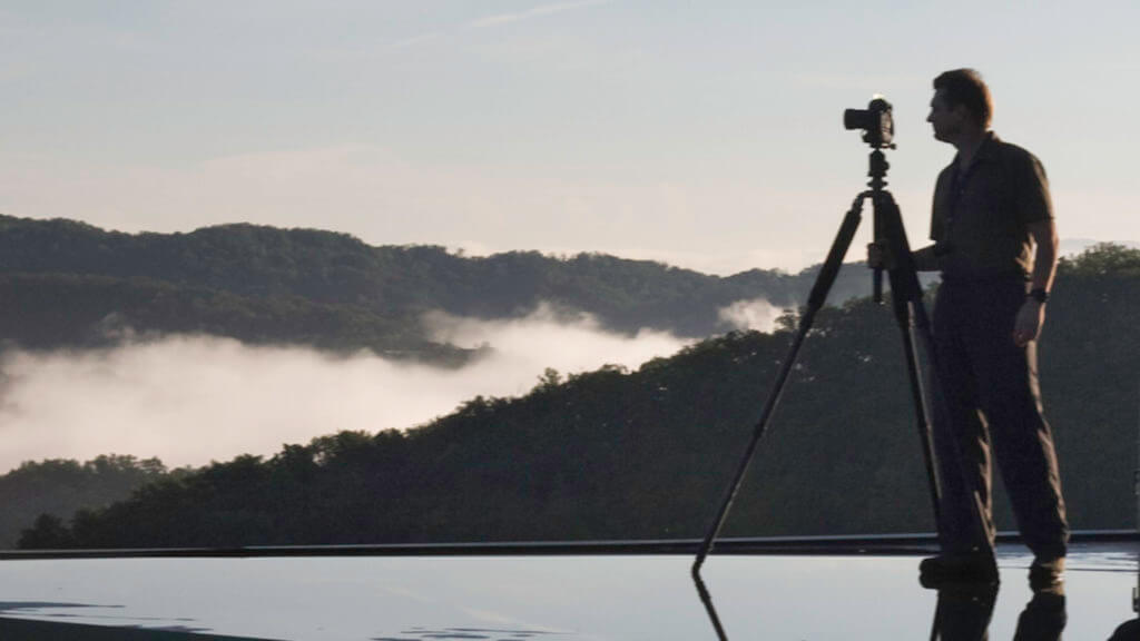 A portrait of architectural photographer Rion Rizzo photographing on location in the Smoky Mountains