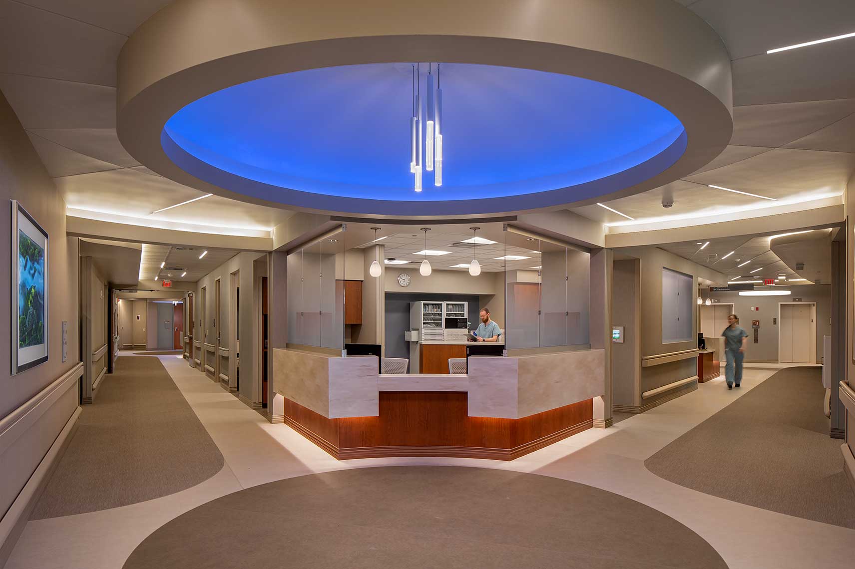 Bold lighting and striking design accent the nurse station at Emory Johns Creek Hospital