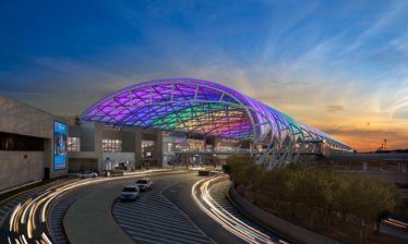 The canopy glows in a rainbow of colors at dusk at Hartsfield Jackson Atlanta International Airport