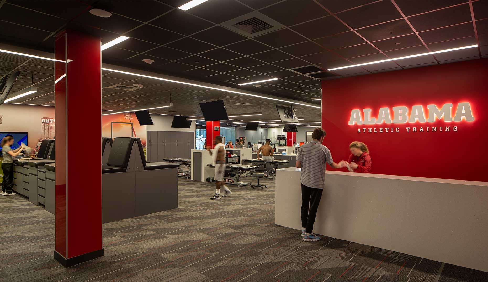 Trainers work on keeping student athletes healthy in the well-equipped Univ. of Alabama Athletic Training Facility