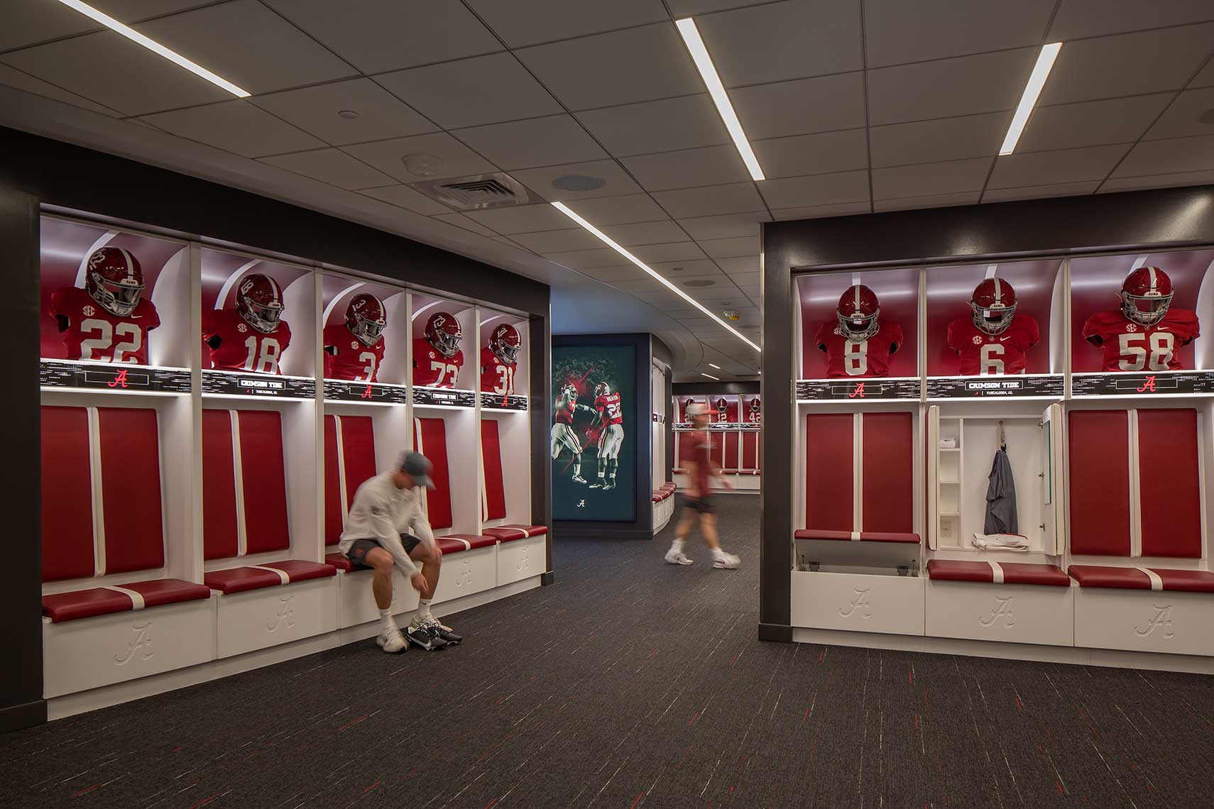 Players prepare for a game in the University of Alabama locker room at Bryant-Deny Stadium