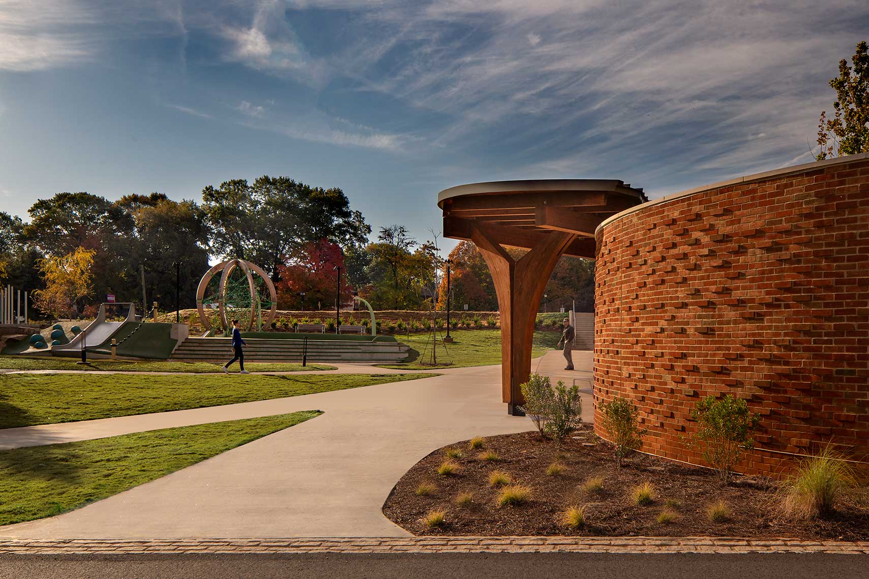 An early-morning view of patrons enjoying the pathways at the South Pavilion of Avondale Town Green
