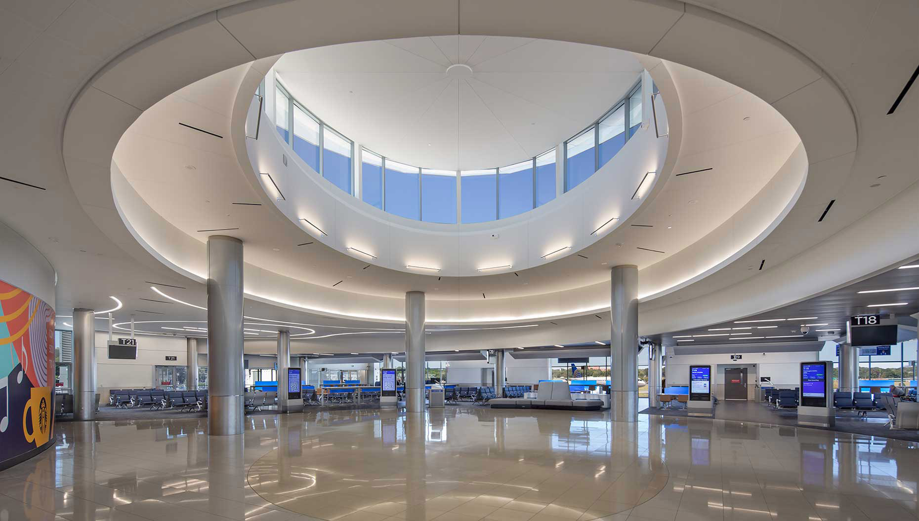 A view of the open and airy oculus at the center of the Concourse T North Expansion at HJAIA