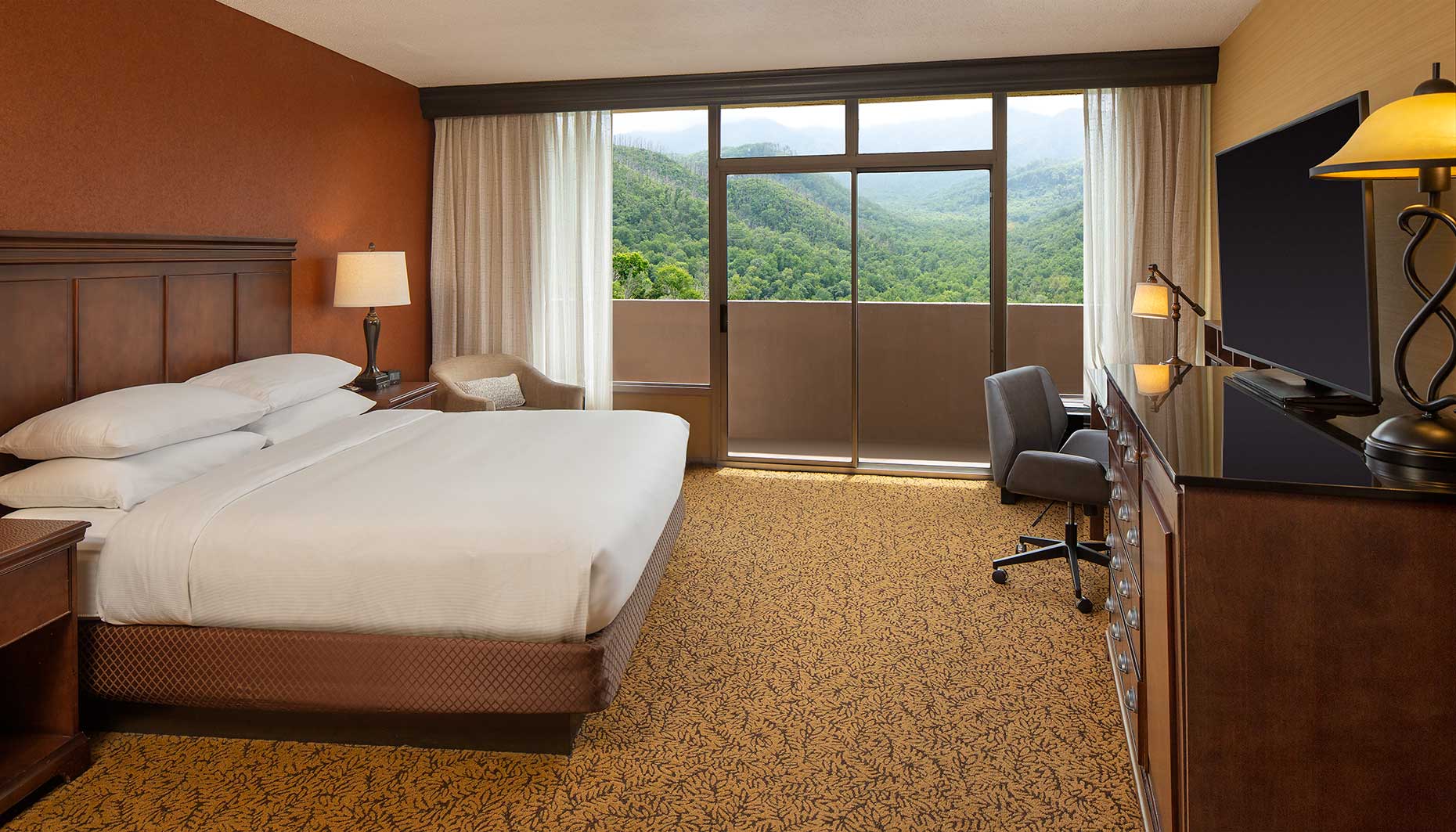 A view of a guest room and the beautiful mounting view out the window at Park Vista Doubletree Hotel