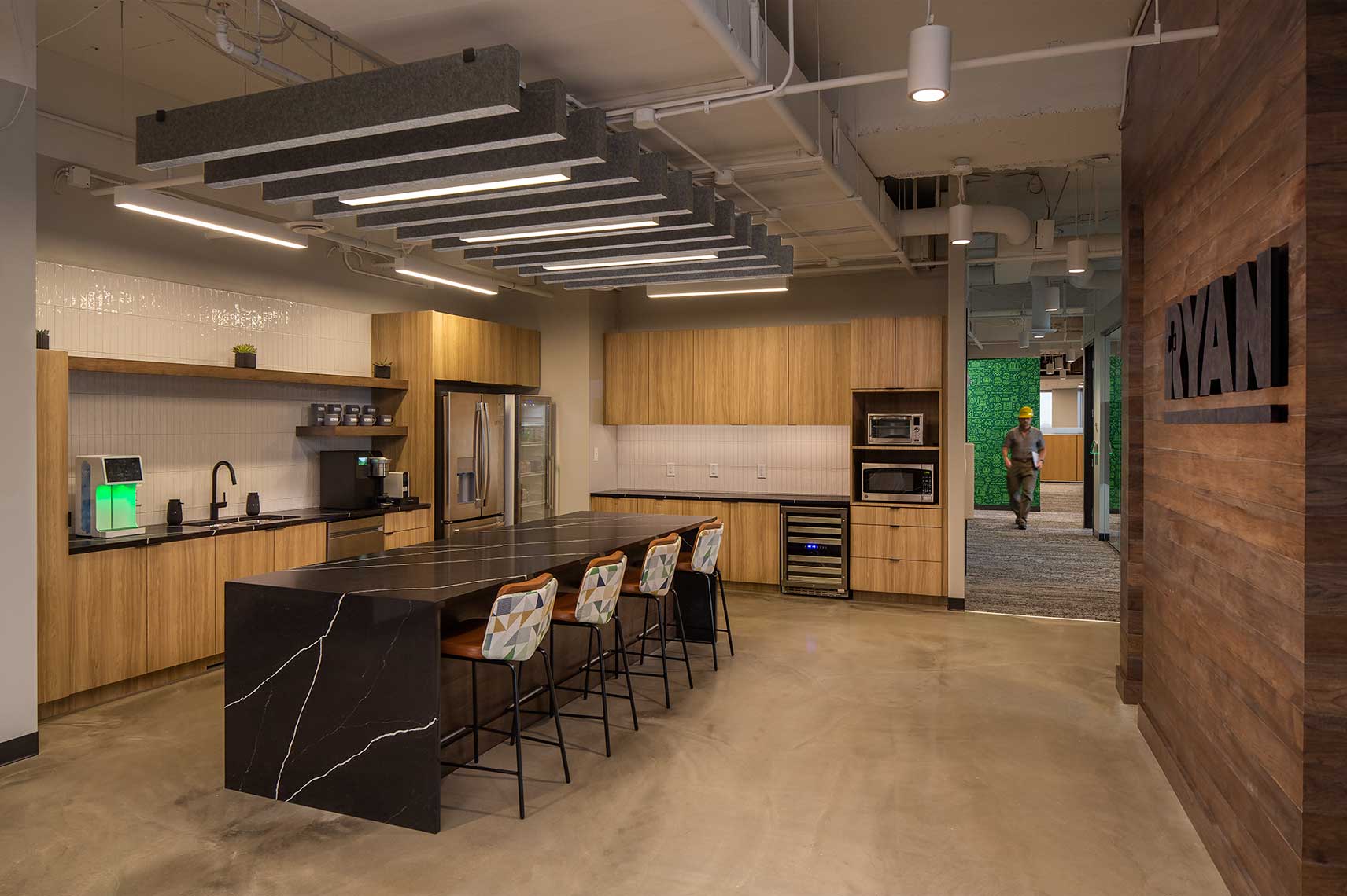 An image of the Break Room within the Ryan Companies' Atlanta offices, showing a warm and expansive area for employees to relax and take a break
