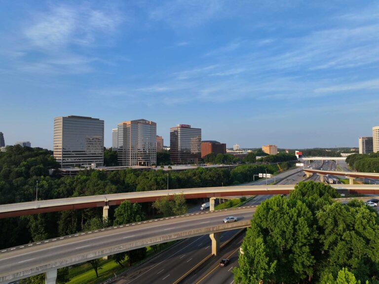 A drone aerial view of the Cobb Galleria Centre buildings as seen from over interstate 285