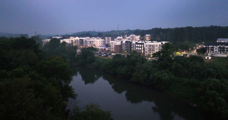 A drone elevated view of the Chattahoochee River at dawn with The Series at Riverview Landing