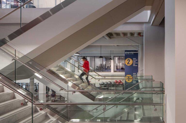 An interior photograph of an open stairway in Seibert Hall at Samford University, showing the stairway in relation to the surrounding exercise spaces.