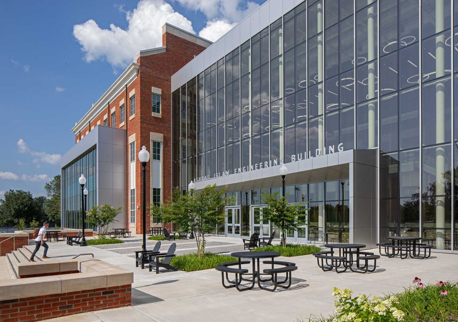 An exterior view of the patio outside of the Tennessee Tech Ashraf Islam Engineering Building, showing seating for students and faculty to enjoy the outdoors setting