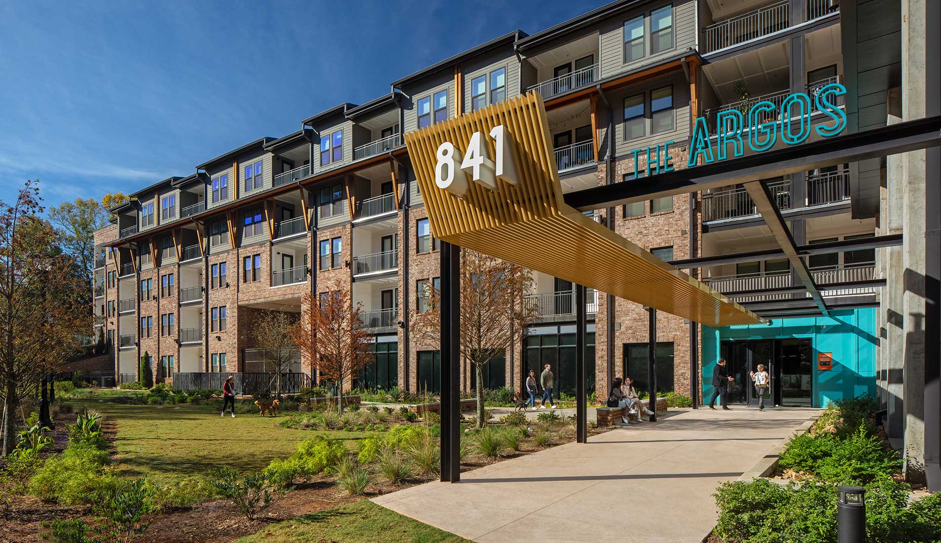 Residents and guests enjoy a beautiful morning outside The Argos Apartment Community on the Beltline in Atlanta
