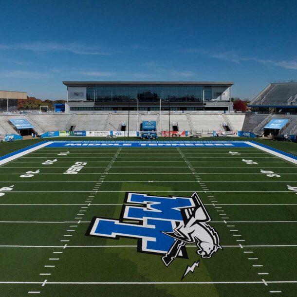 An elevated view of the Middle Tennessee State University Student-Athlete Performance Center looking over the football field and the athletic logo