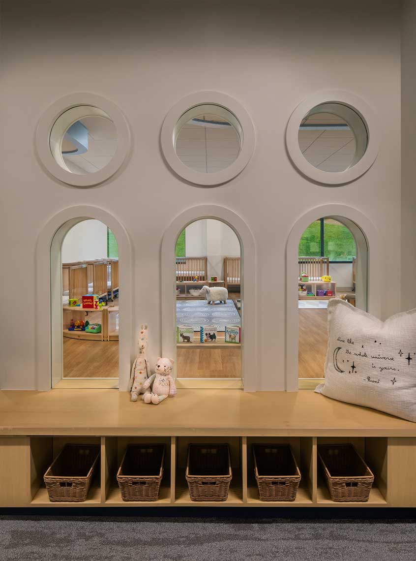 A detail view of the individual student cubbies and fun window detailing at the AlleGro Early Learning Center